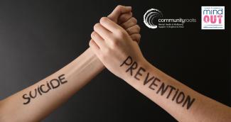 Photo of two arms with hands holding and writing on arms reading "suicide prevention" and MindOut and Community Roots logos