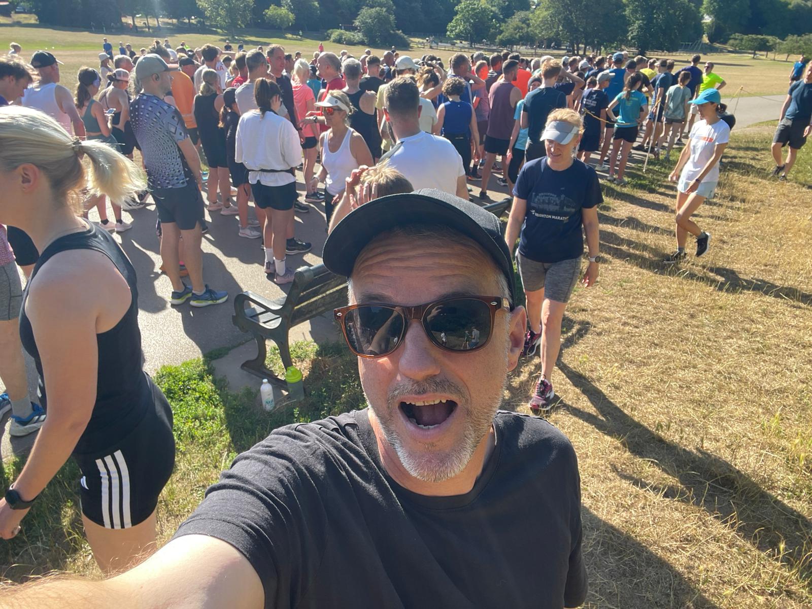 A man excited about their 5k run.