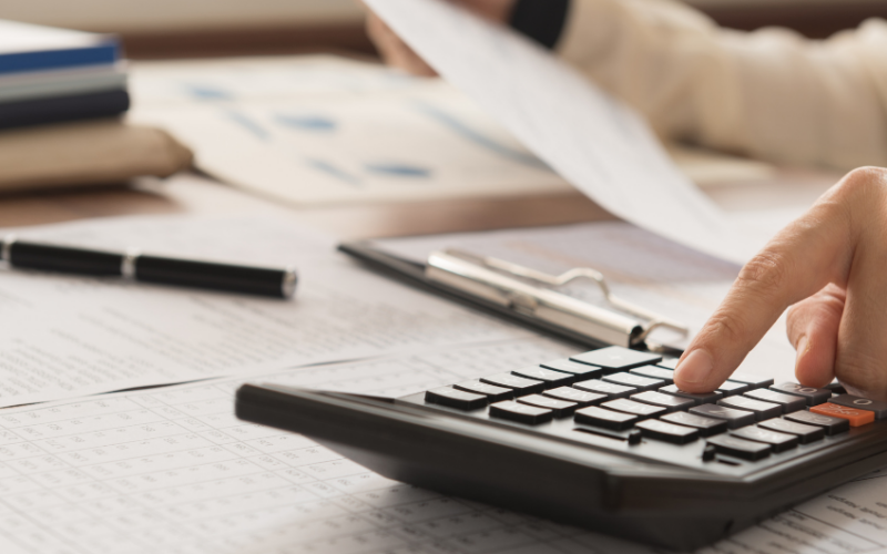 a representative image of a person calculating their finanaces.